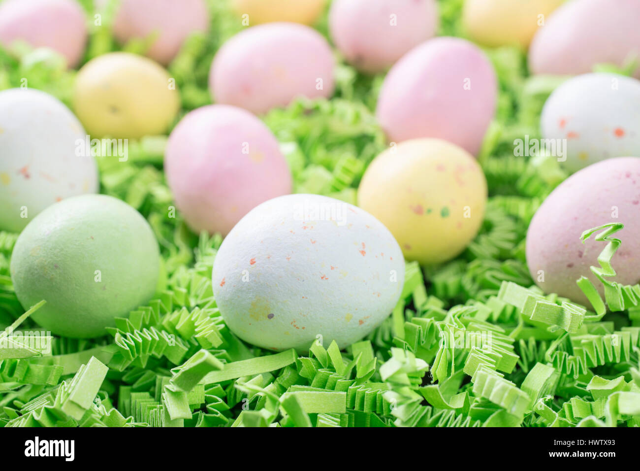 Malted Candy Easter Eggs laid on a bed of green crepe paper Stock Photo Alamy