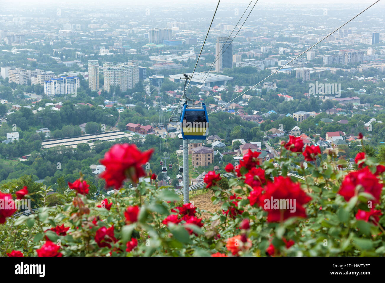 Almaty city view from Koktobe hill and cabin of cable car, landmark in
