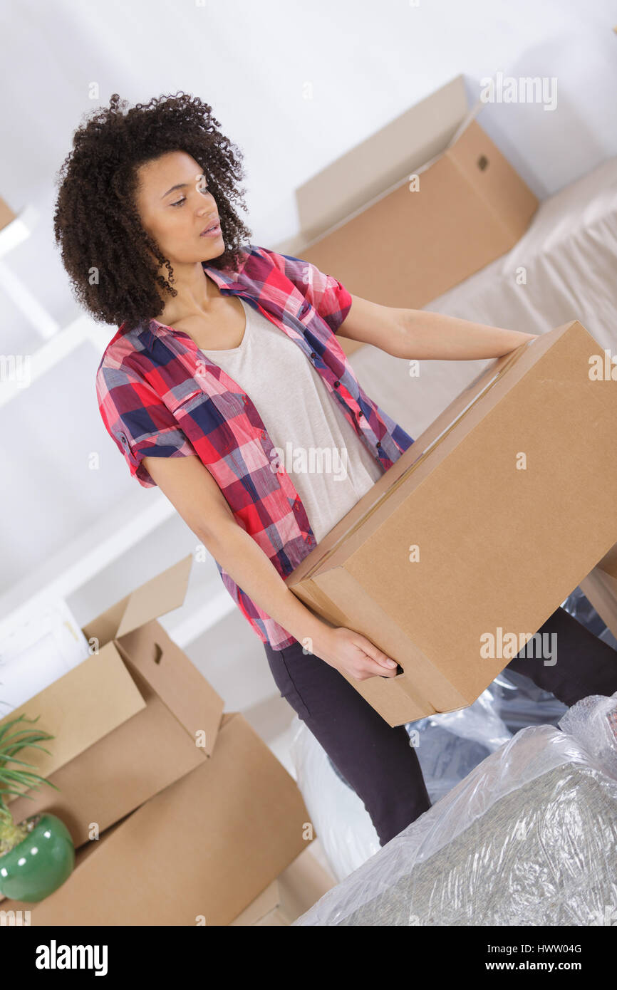 Woman packing clothes boxes hi-res stock photography and images - Alamy