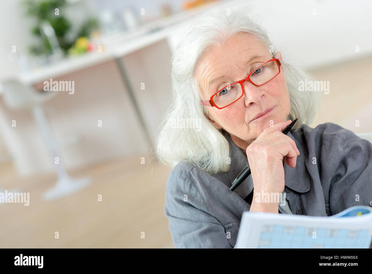 Old last doing a crossword Stock Photo Alamy Old last doing a crossword Stock Photo Alamy