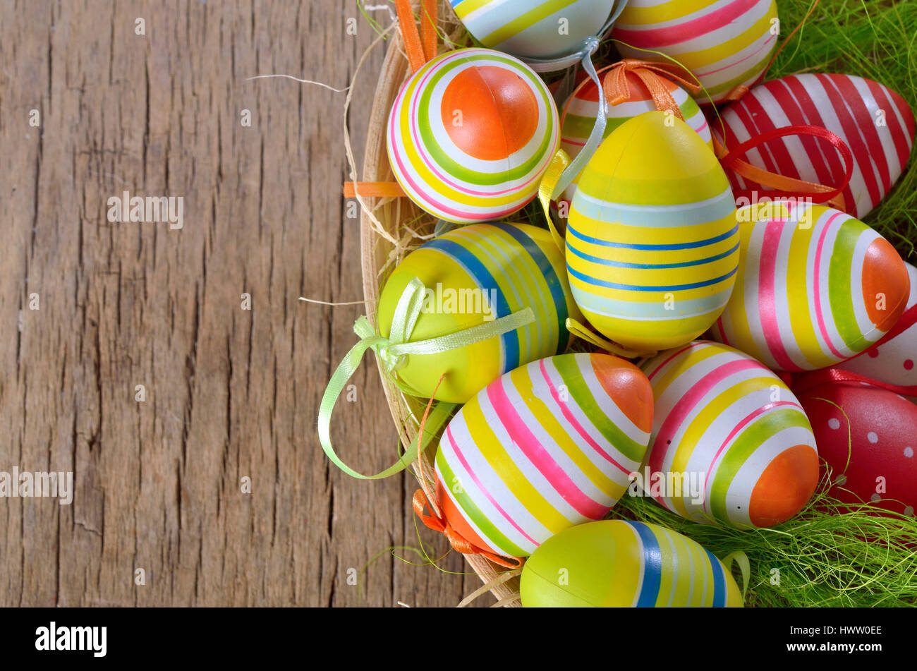 Colorful easter eggs isolated in basket Stock Photo - Alamy