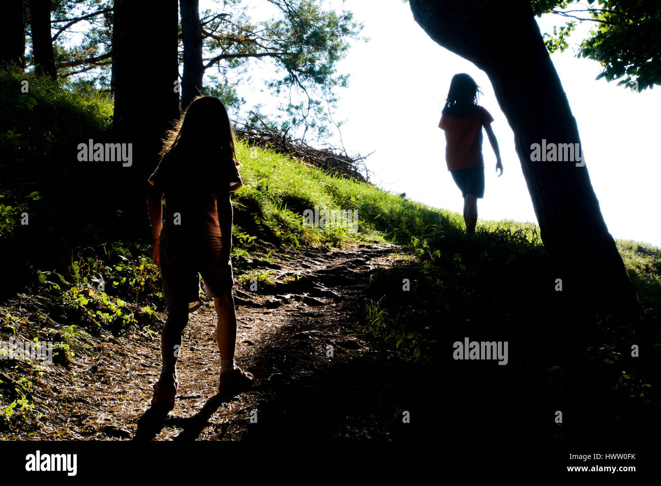Hiking in the evening with two preteen girls Stock Photo
