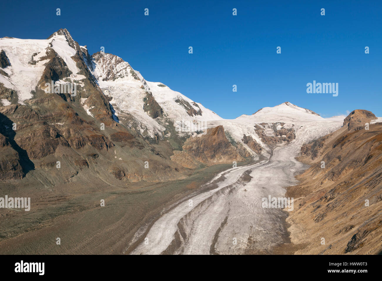 The Großglockner peak and Pasterze Glacier in the Hohe Tauern National Park in Austria on a clear day. Stock Photo