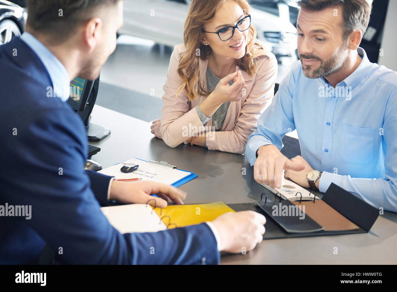 Car salesman sitting desk in hires stock photography and images Alamy