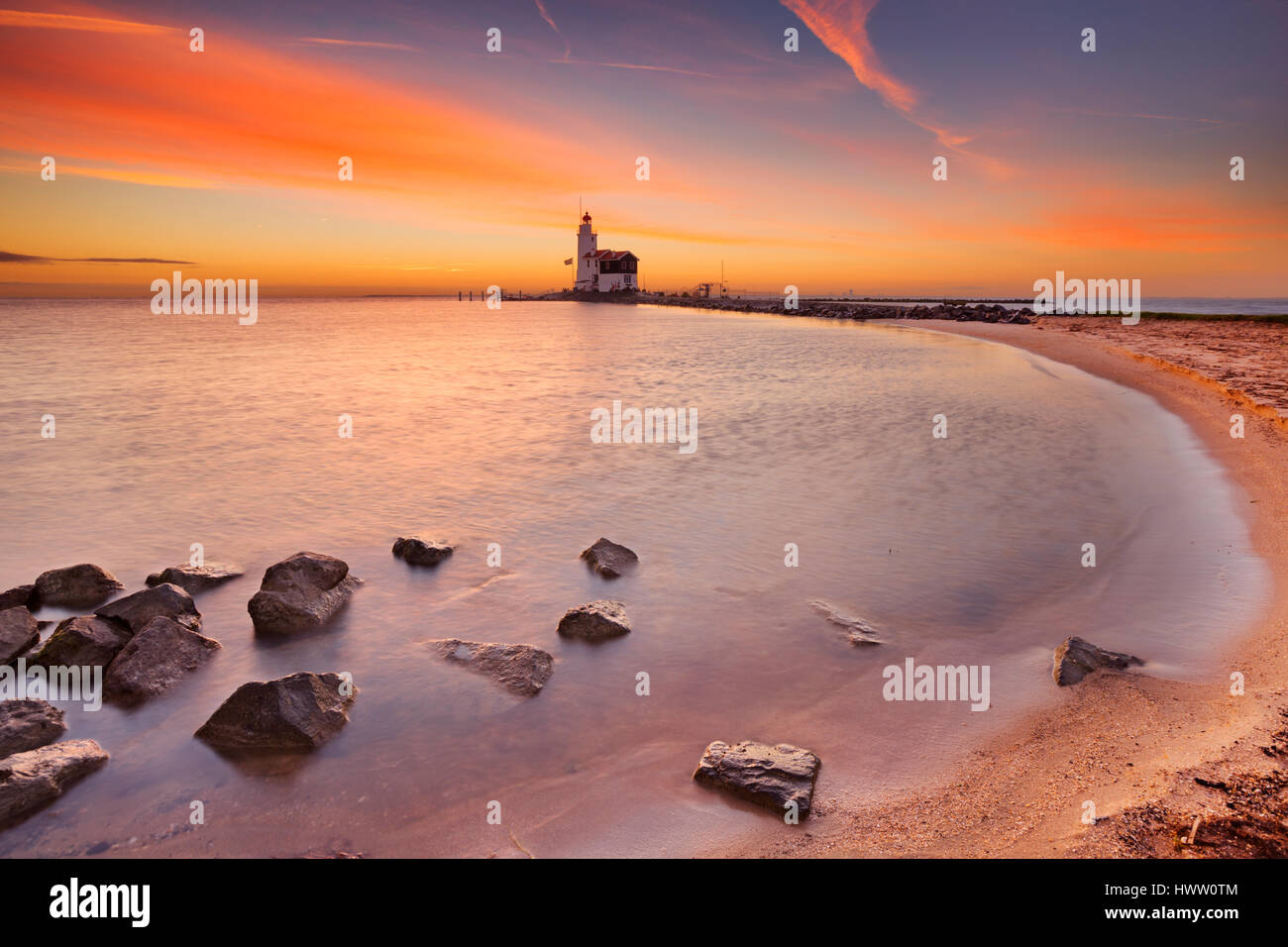 The lighthouse on the island of Marken in The Netherlands. Photographed at sunrise. Stock Photo