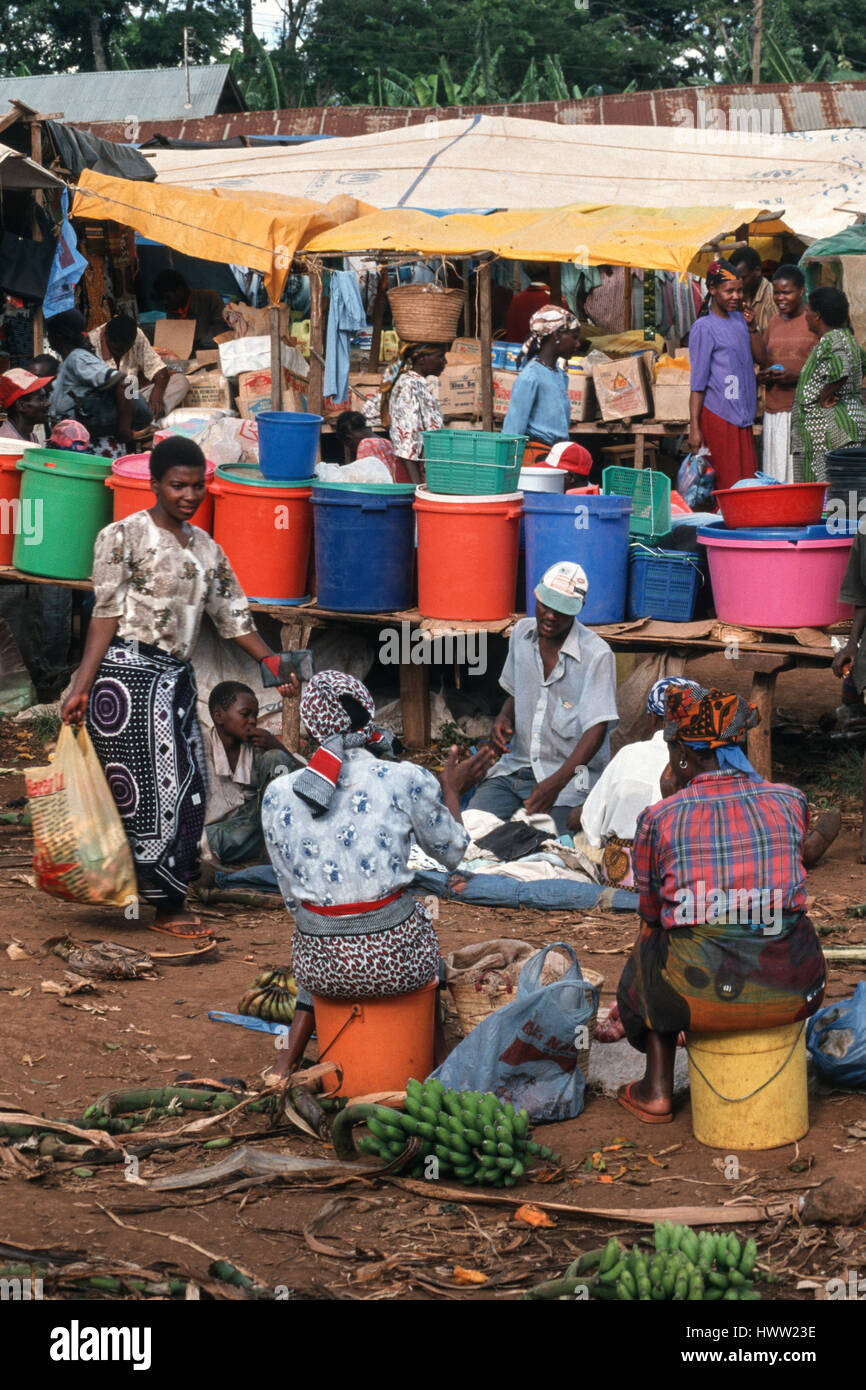 Women sell kooking bananas on a busy market in Kwasadala, Kilimanjaro Region, Tanzania Stock Photo