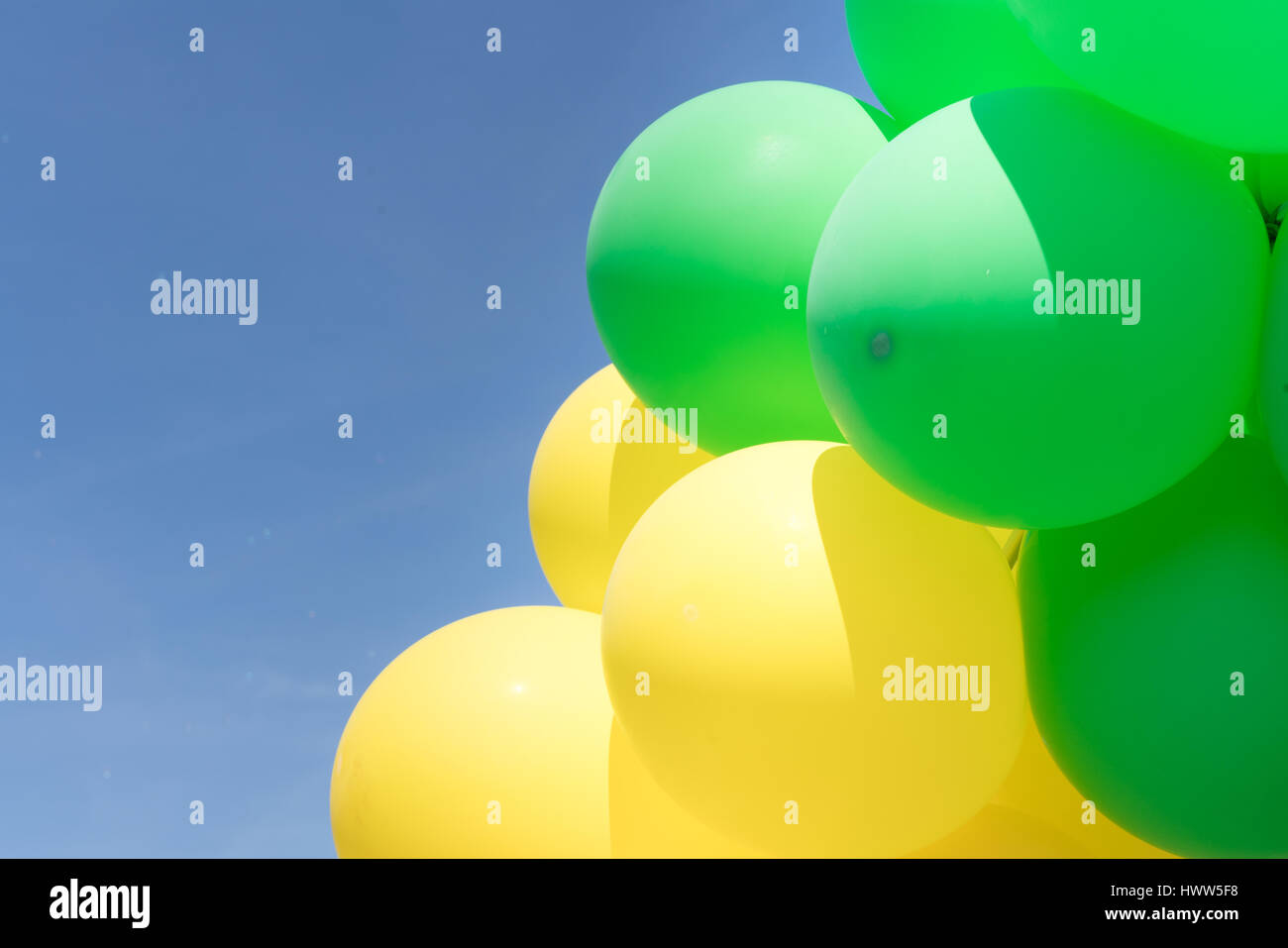 Multi colour balloons in a bunch floating in the sky Stock Photo - Alamy