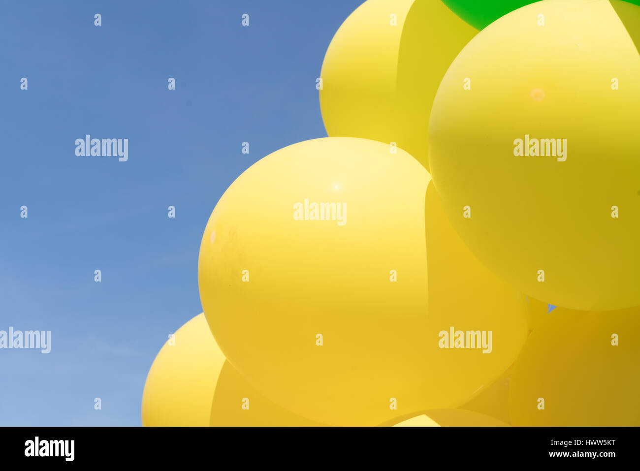 Multi colour balloons in a bunch floating in the sky Stock Photo - Alamy