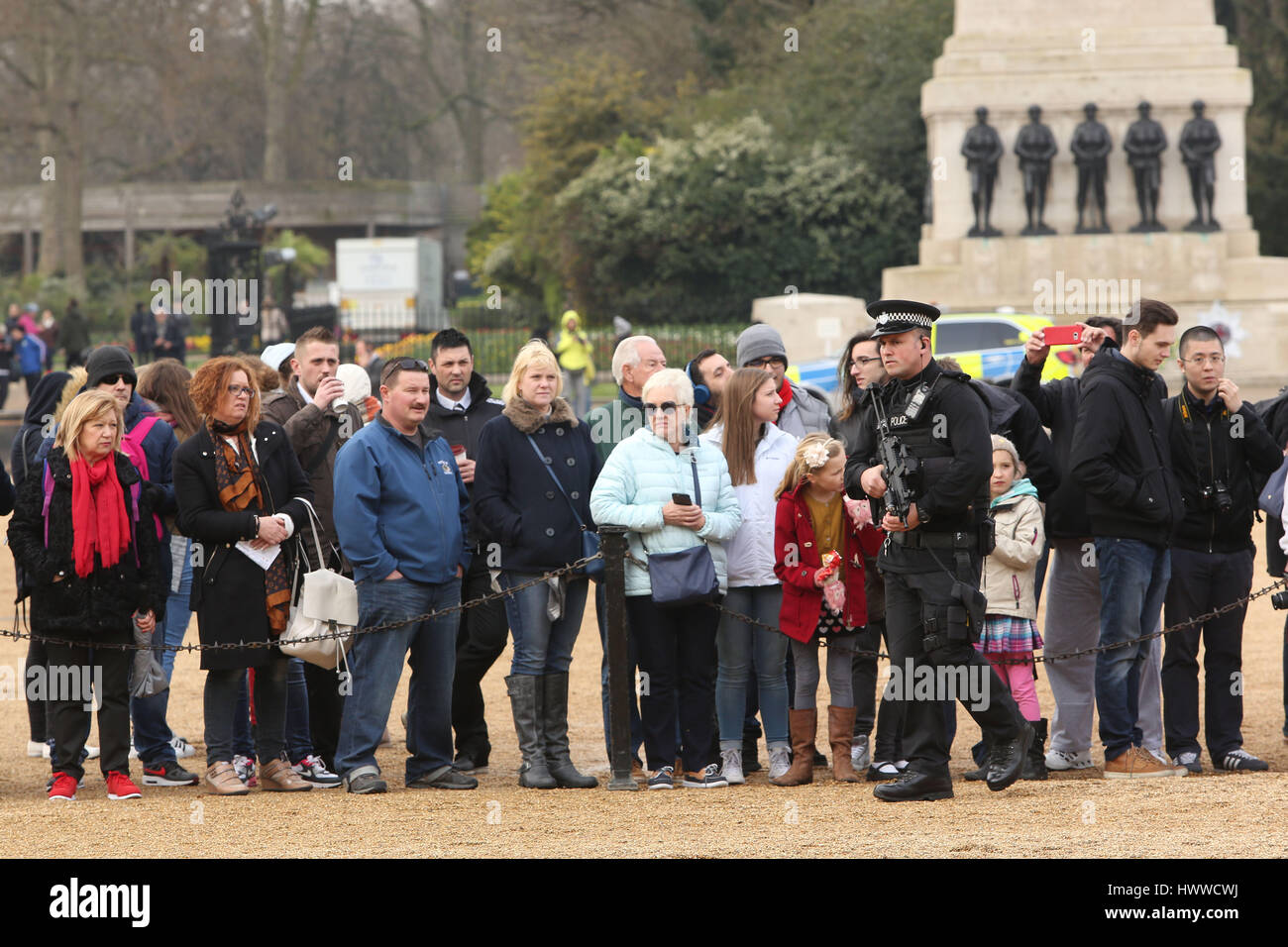 London, UK. 23rd March 2017.   Armed Police watch over mounted soldiers and tourists on Horse Guards Parade. Credit: Nigel Bowles/Alamy Live News Stock Photo
