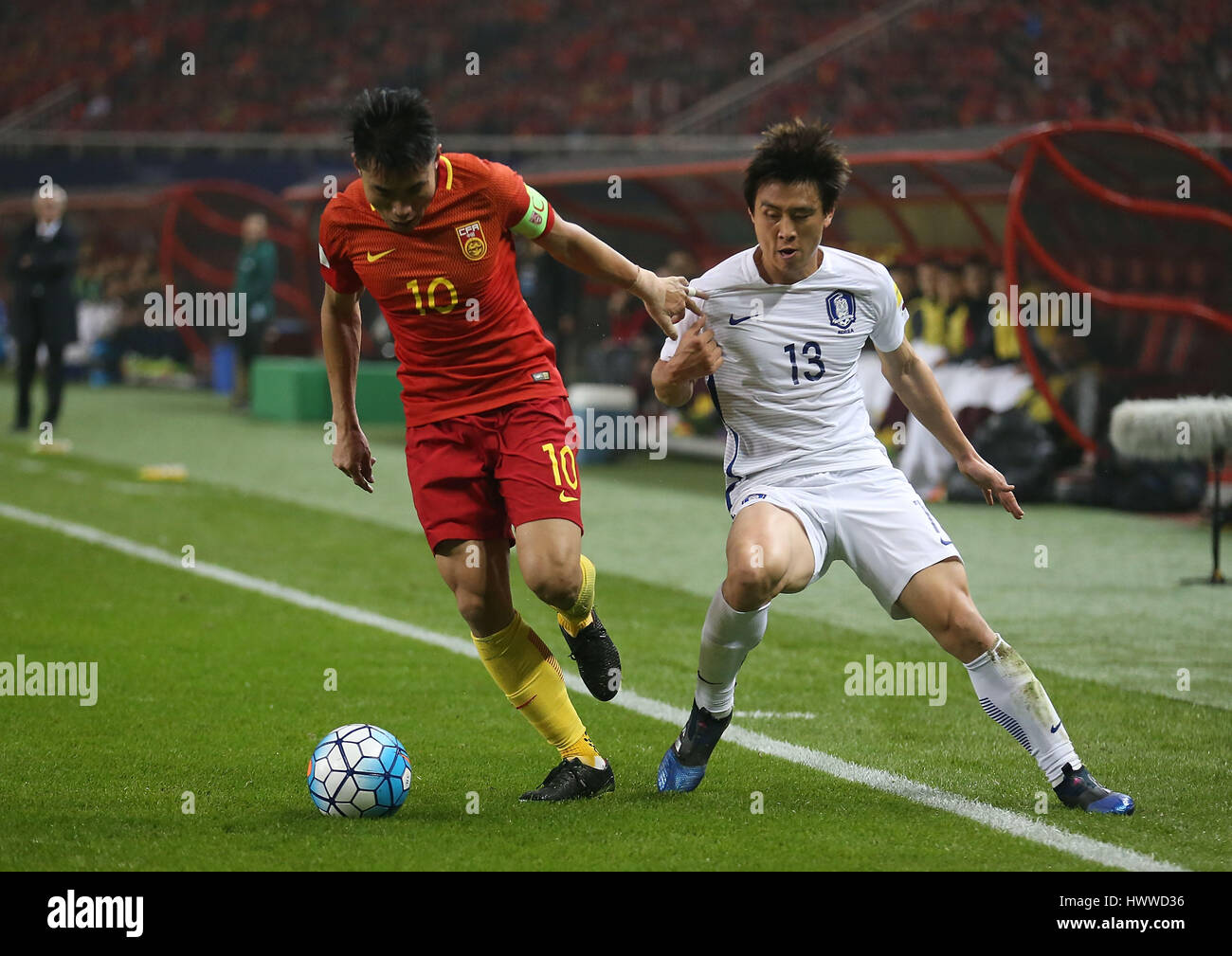 Changsha, China's Hunan province. 23rd Mar, 2017. China's Zheng Zhi (L) vies with South Korea's Koo Ja Cheol during the 2018 FIFA World Cup Russia qualification match in Changsha, central China's Hunan province, March 23, 2017. Credit: Cao Can/Xinhua/Alamy Live News Stock Photo