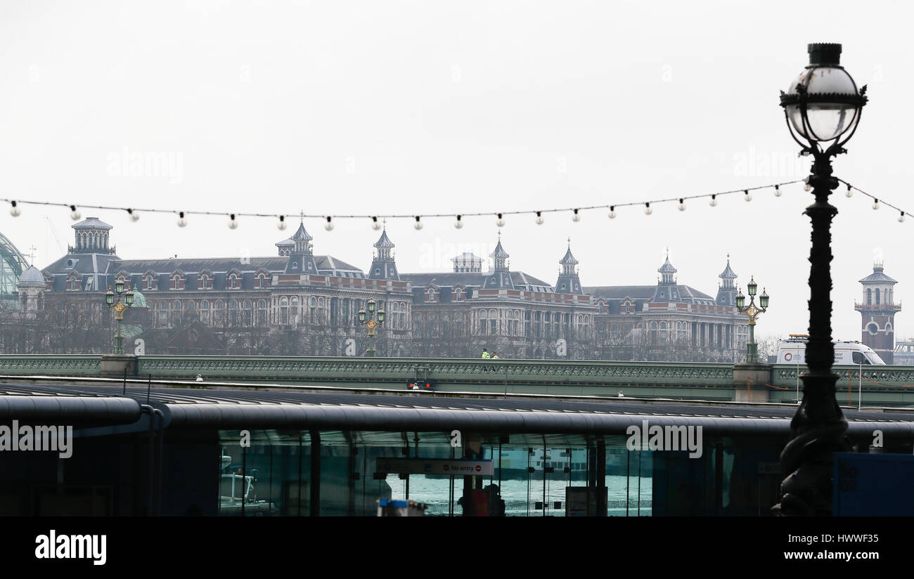 London, UK. 23rd Mar, 2017. Policemen patrol over the blocked Westminster Bridge near Houses of Parliament in London, Britain on March 23, 2017. Credit: Han Yan/Xinhua/Alamy Live News Stock Photo