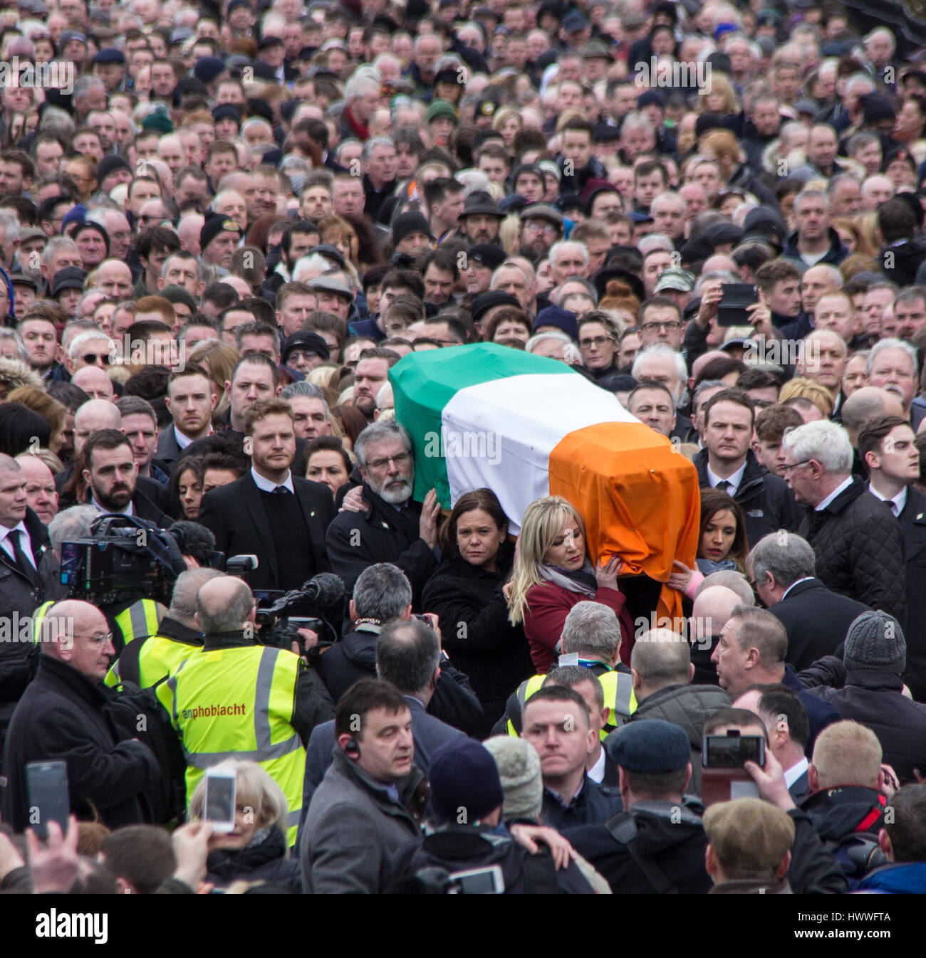 Derry, UK 23 March 2017. Gerry Adams and Michelle O'Neill carry the coffin of Martin McGuinness through the Bogside in Derry. Photo by Mickey Rooney/Alamy Live News.  Stock Photo
