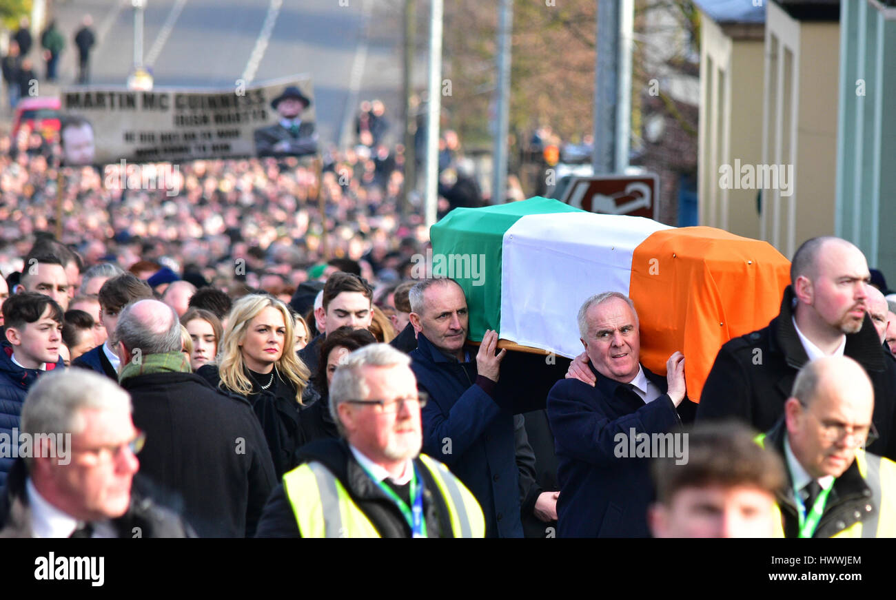 Derry, Northern Ireland. 23rd March, 2017. Sinn Feins Raymond McCartney at the front carrying the remains of Sinn Féins Martin McGuinness in Derry: Mark Winter/Alamy Live News Stock Photo