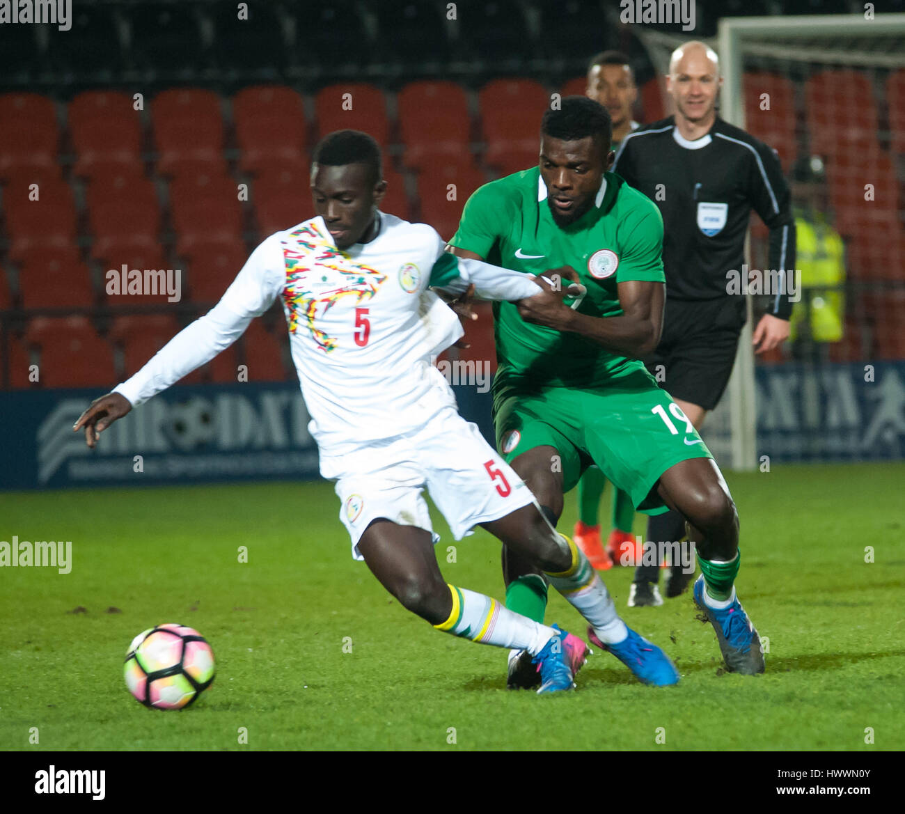 The Hive, Barnet,  England. 23rd March 2017. Idrissa Gana Gueye of Senegal battles for the ball with John Ogu of Nigeria during the International Friendly match between Nigeria and Senegal. Michael Tubi / Alamy Live News Stock Photo