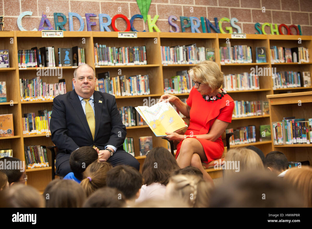 Bethesda, United States Of America. 23rd Mar, 2017. U.S. Secretary of Education Betsy DeVos reads Dr. Seuss to children during a visit with Maryland Gov. Larry Hogan to Carderock Springs Elementary School March 23, 2017 in Bethesda, Maryland. Credit: Planetpix/Alamy Live News Stock Photo