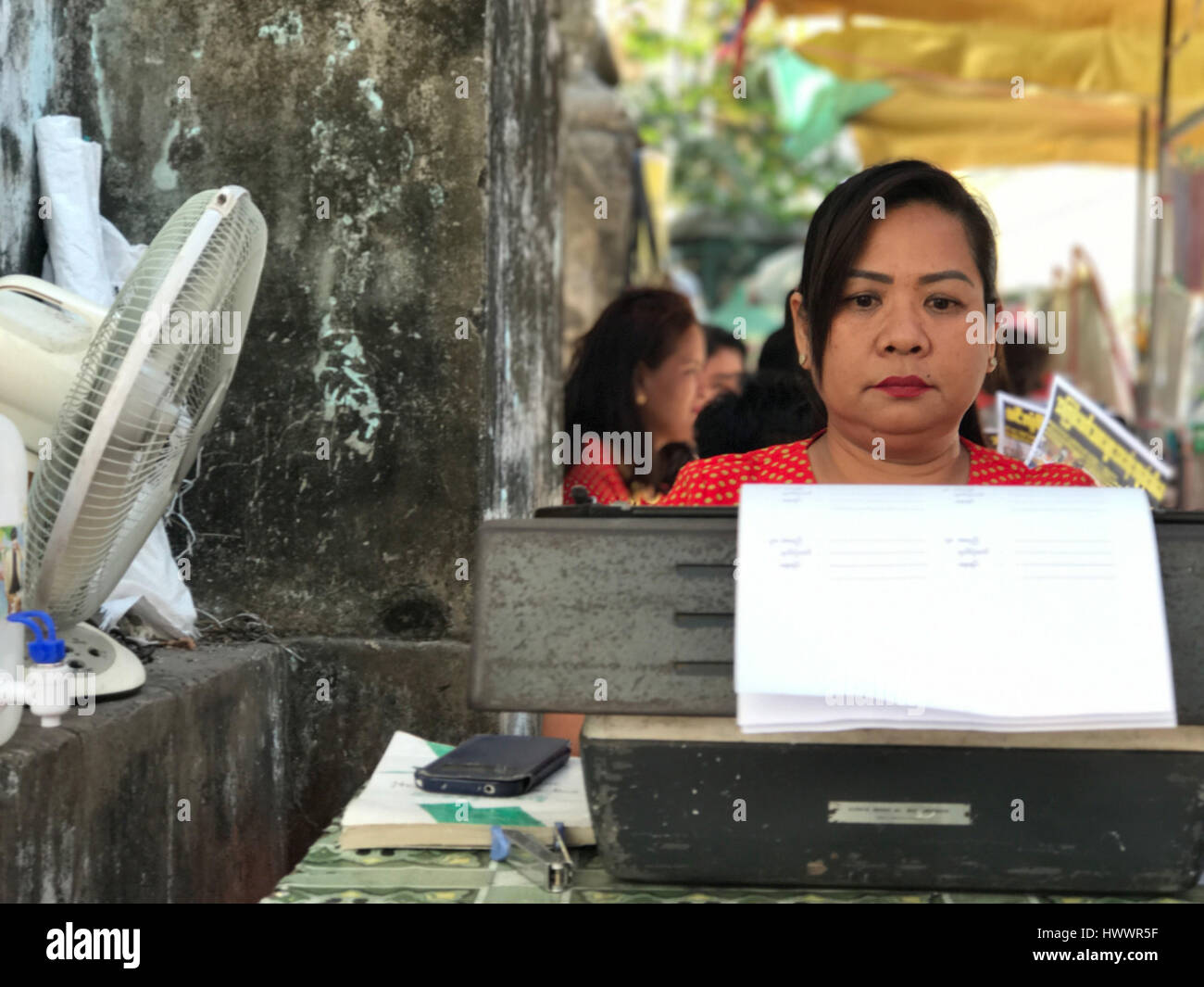 Yangon, Myanmar. 20th Feb, 2017. Ma Thet works at her typewriter in Yangon, Myanmar, 20 February 2017. In the 'district of notaries', two dozens of women and men fill in official documents of their clients, using old typewriters, most of which are German productions. But the trade is slowly dying, computers and smartphones also take over in Myanmar. Photo: Christoph Sator/dpa/Alamy Live News Stock Photo