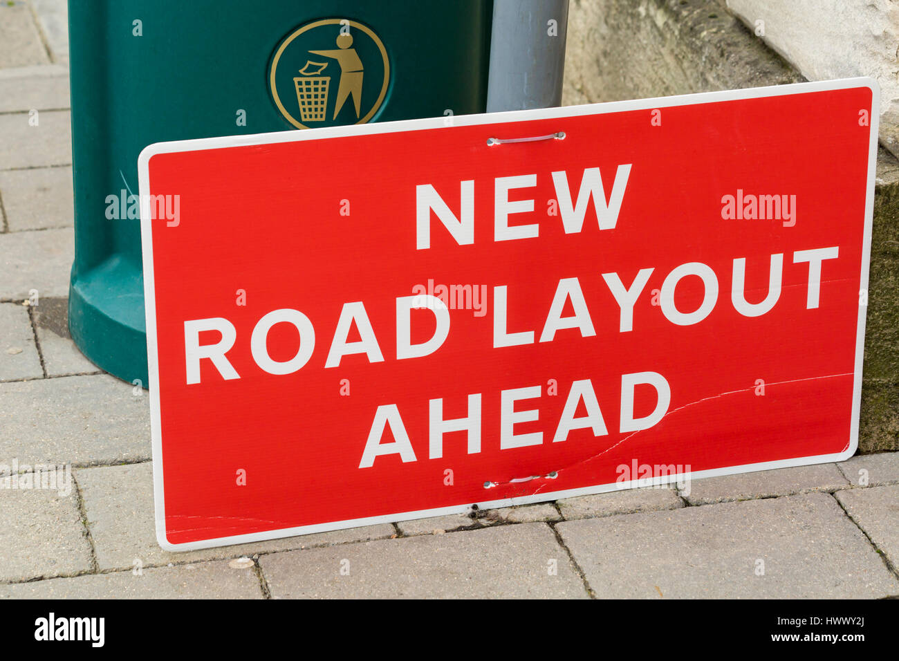 New Road Layout ahead sign on ground, fallen from post Stock Photo