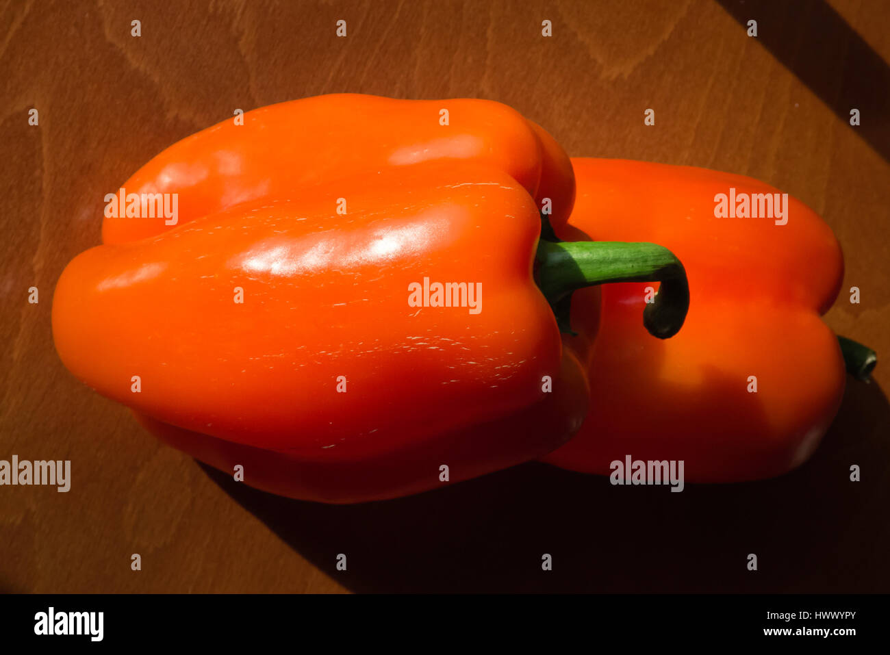 Peppers on woody background. Stock Photo