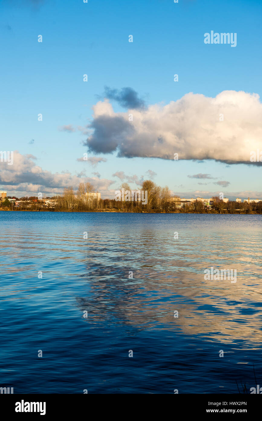 White clouds over the river with blue sky and city skyline Stock Photo ...