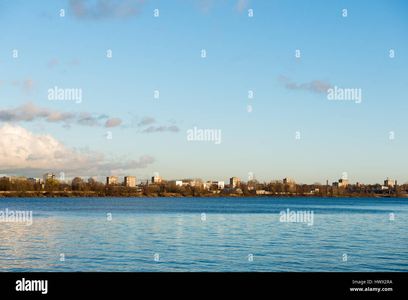 White clouds over the river with blue sky and city skyline Stock Photo ...