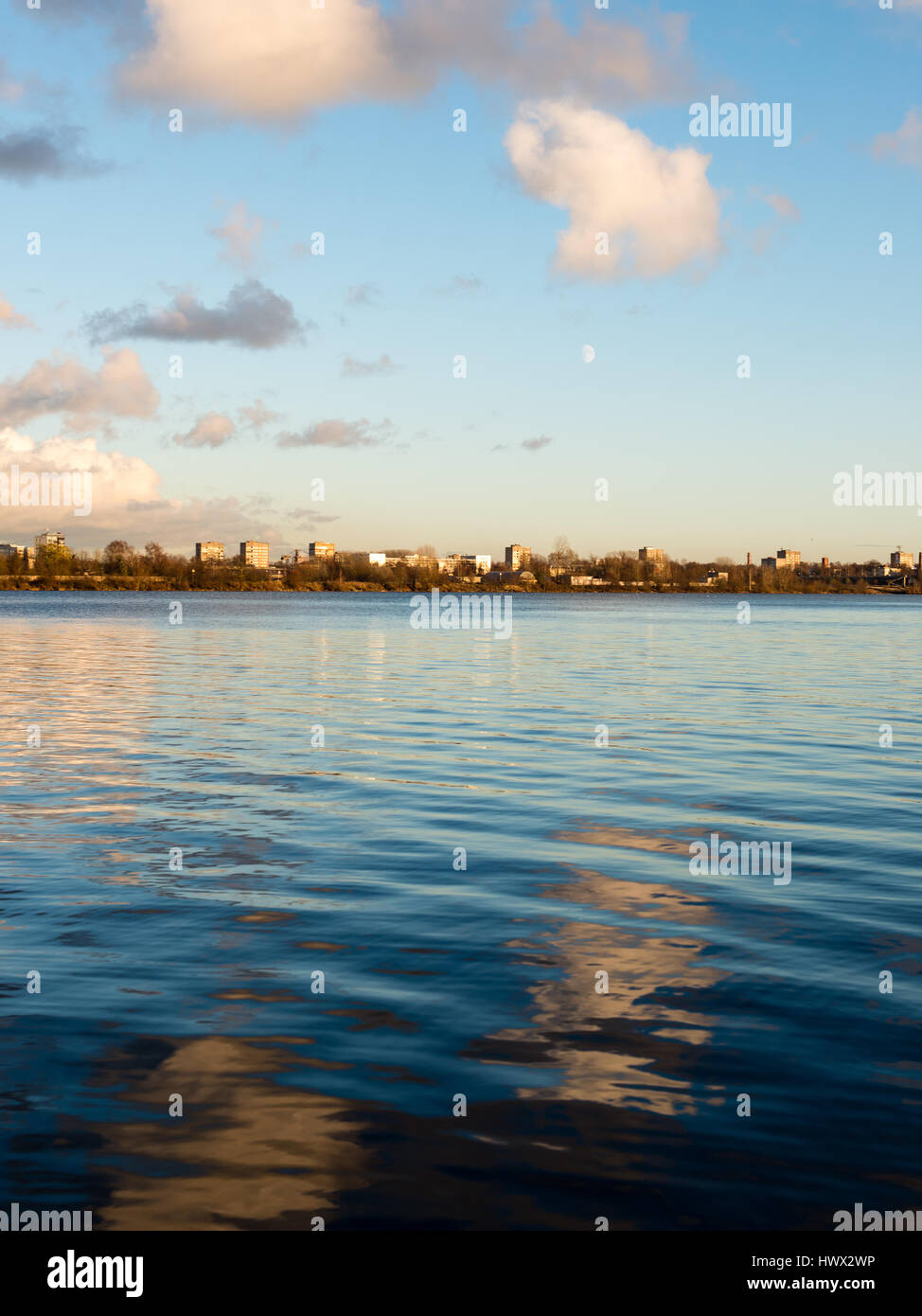 White clouds over the river with blue sky and city skyline Stock Photo ...