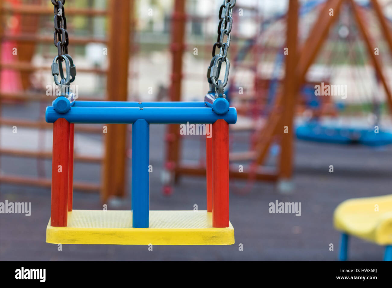Swing in children's playground Stock Photo