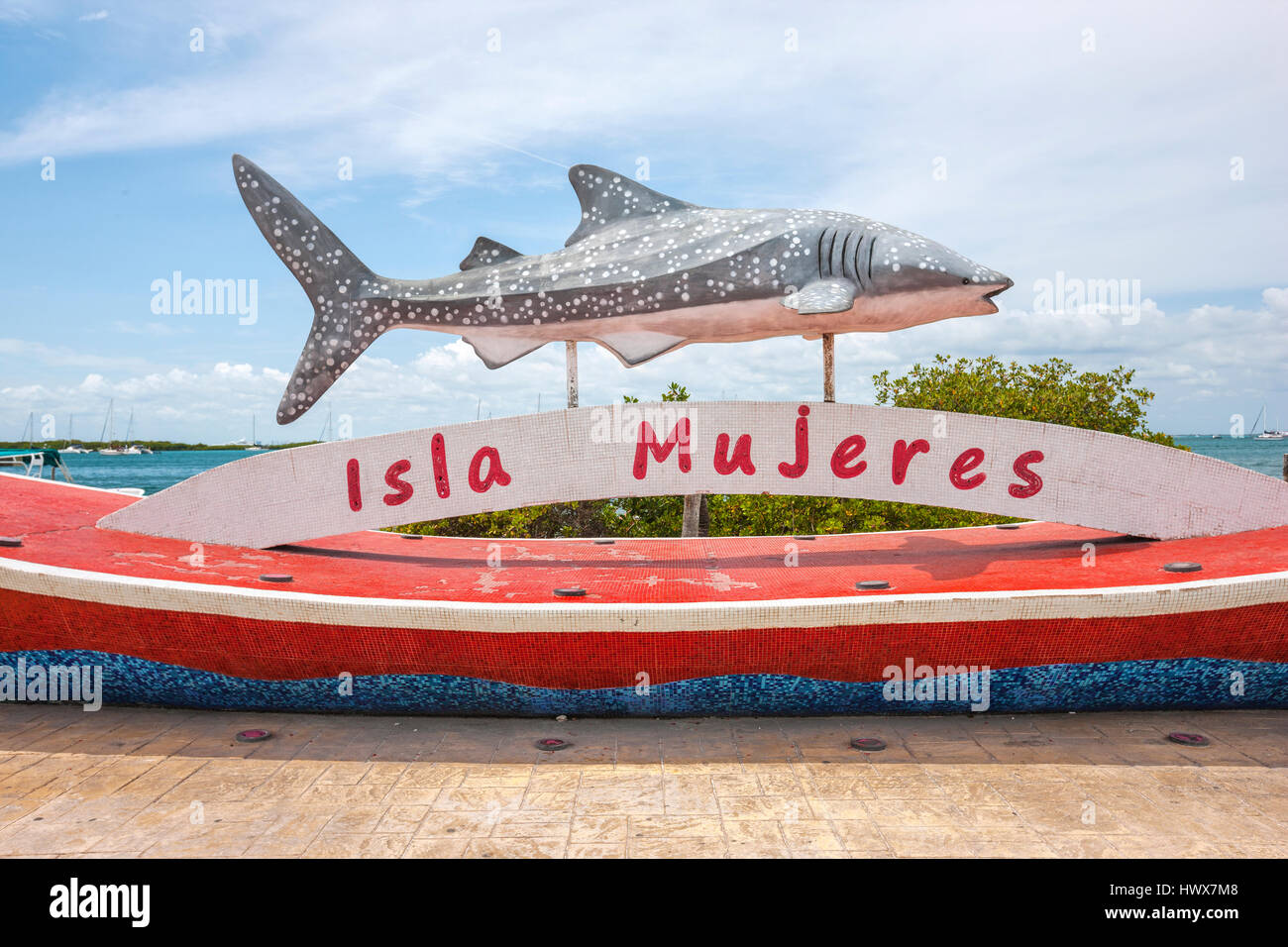 Statue with shark and boat on Isla Mujeres Stock Photo Alamy