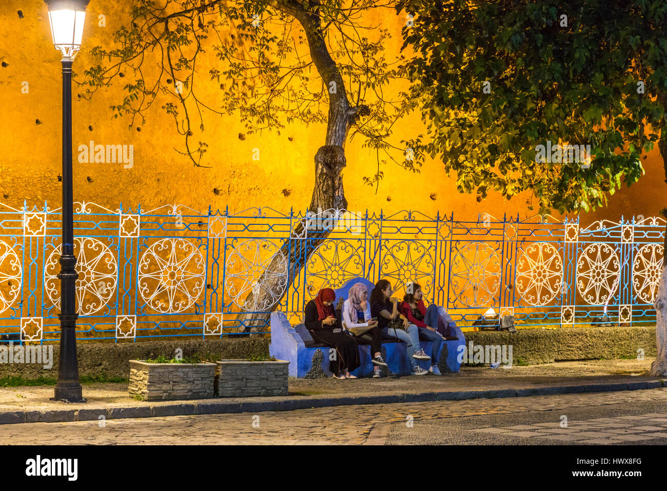 Chefchaouen, Morocco. Women Talking on a bench, Place Outa ElHammam