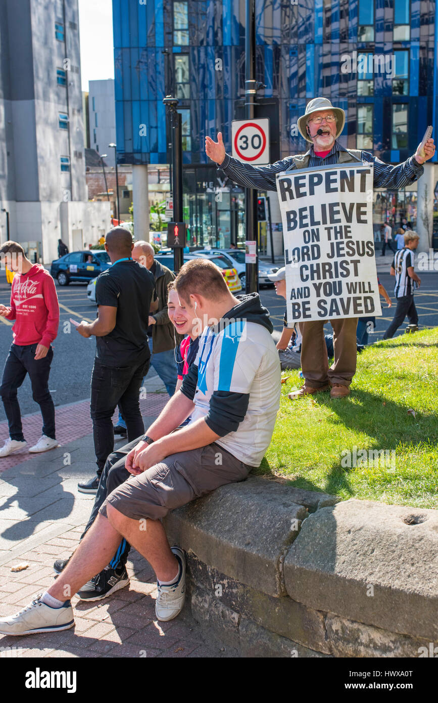 Kenneth from the Scottish Highlands, warning of doomsday and the return of Jesus, outside Newcastle United's St James' Park on matchday to fans. Stock Photo