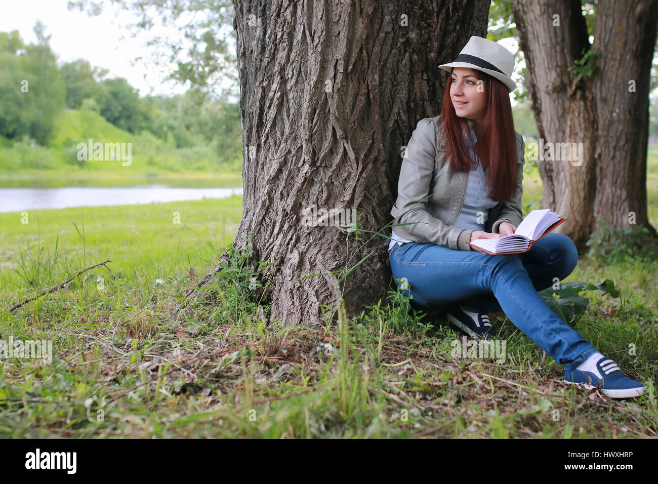girl with book in park Stock Photo - Alamy