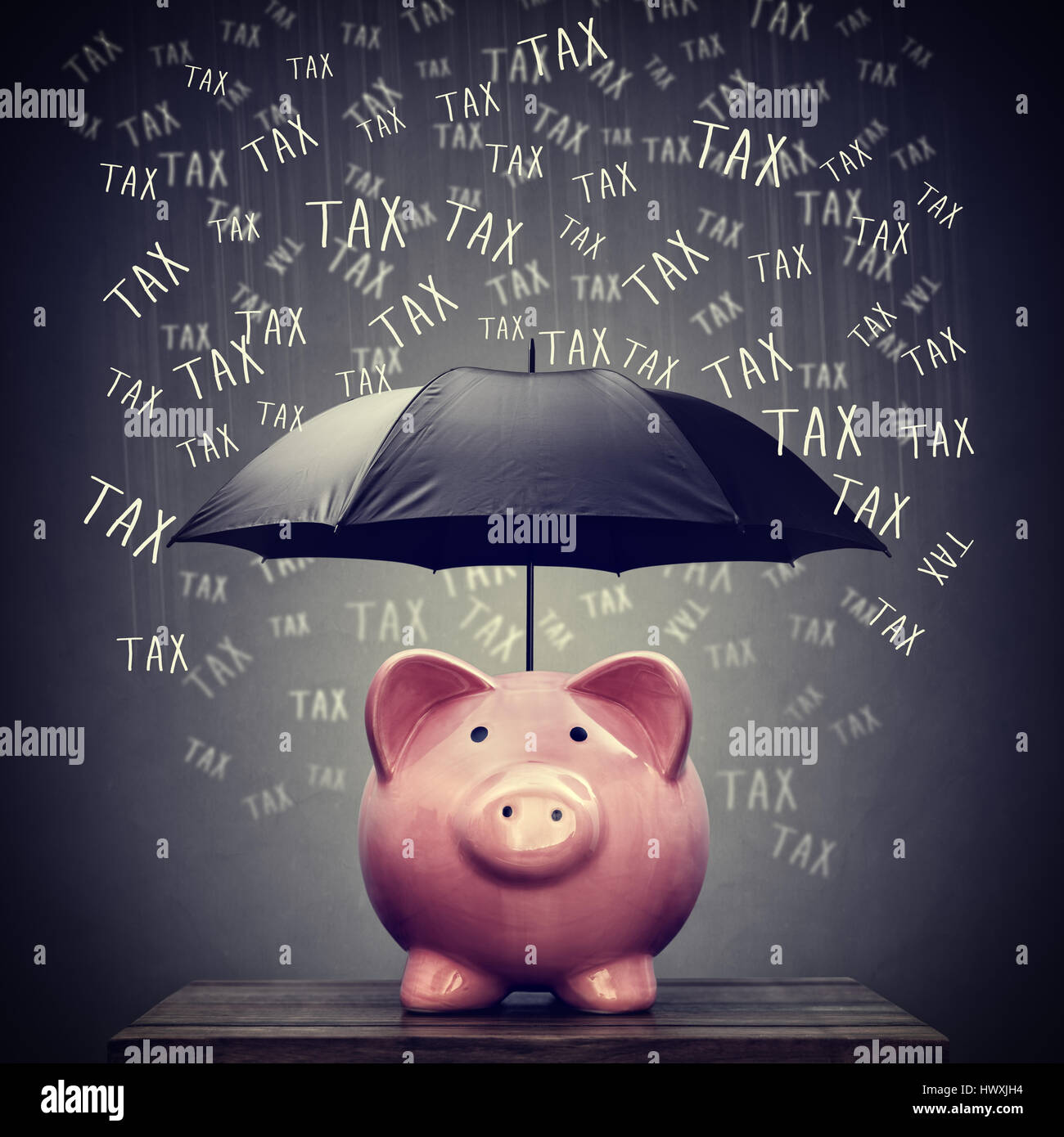 Umbrella for hiding piggy bank savings account from tax Stock Photo