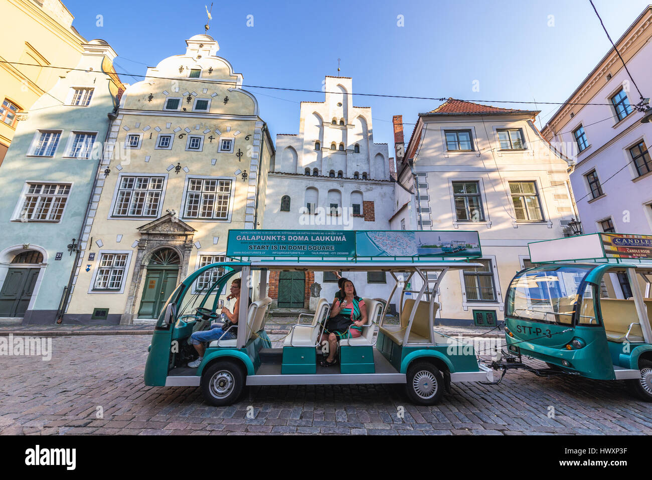 sightseeing tourist train in front of Residential buildings called ...