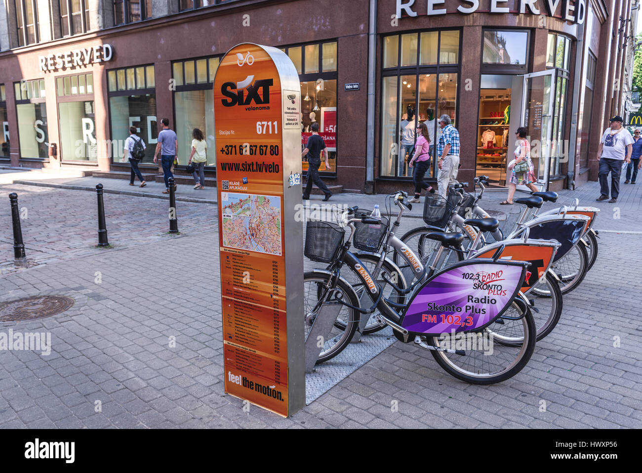 Sixt velo noma bicycle sharing system station on the Old Town of Riga,  capital city of Republic of Latvia Stock Photo - Alamy