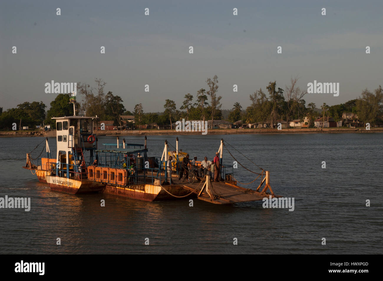 Ferry with passengers crossing the Pangani river, Pangani, Tanga region, Tanzania Stock Photo