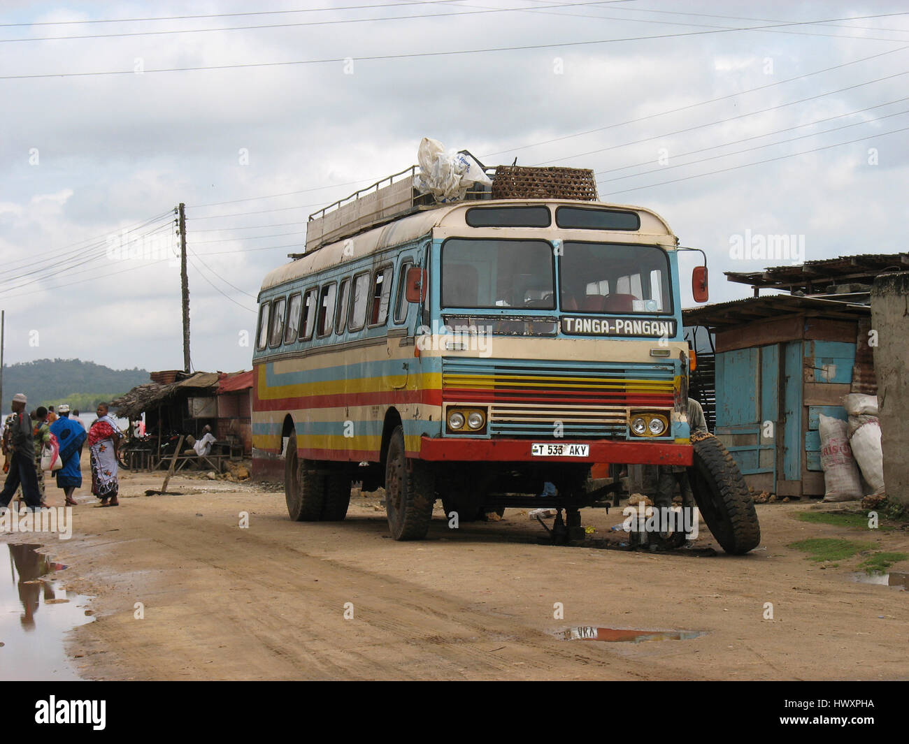 Coach broken down with punctured tyre to be changed, Pangani, Tanga region, Tanzania Stock Photo