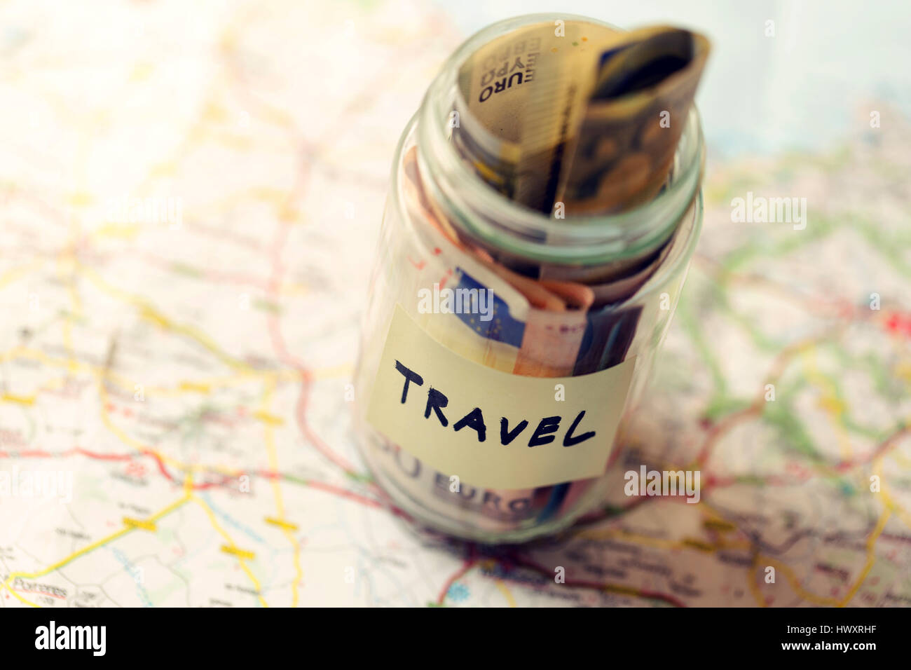 travel budget concept, money savings in a glass jar Stock Photo