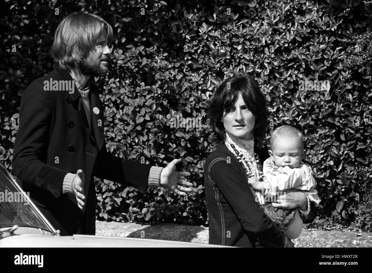 Michael Rainey with his wife Jane (daughter of Lord Harlech) and their six-month-old baby Saffron in Glastonbury, Somerset. They attended court when Camilla Drummond, 21, and Luiz Saldanha, 24, were fined on on drugs charges. The Rainey's were mentioned by Roger Stokes, prosecuting. Stock Photo