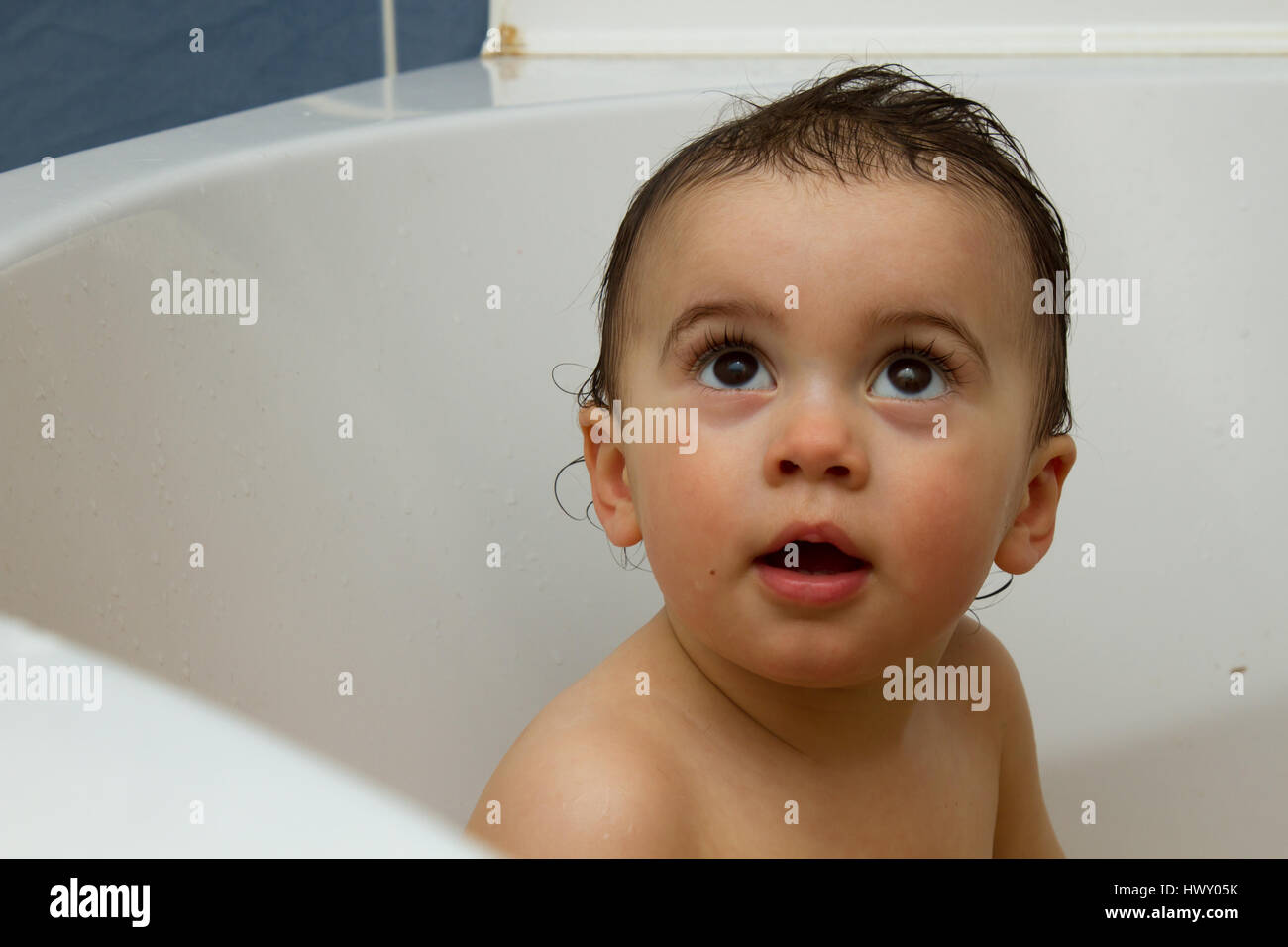 Adorable little toddler boy taking a bath in bathtub Stock Photo Alamy