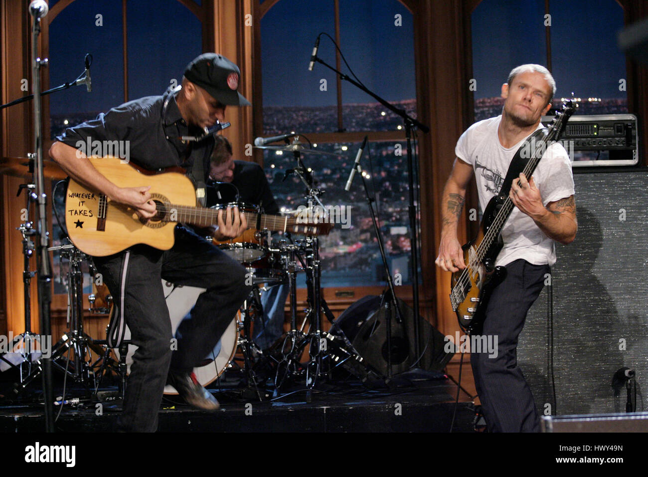 Guitarist Tom Morello, left, and Flea on bass, perform during a segment