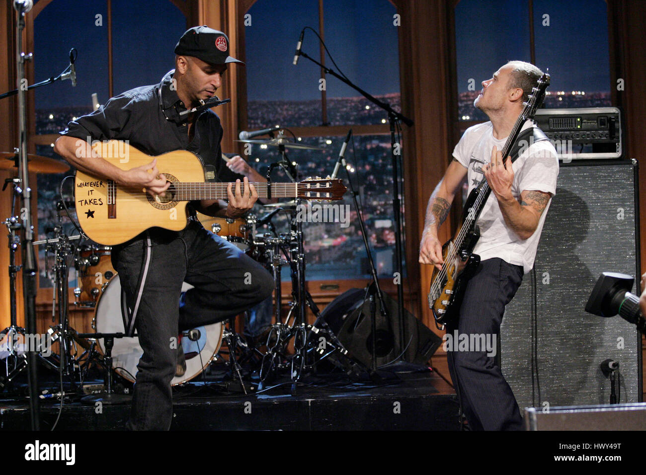 Guitarist Tom Morello, left, and Flea on bass, perform during a segment