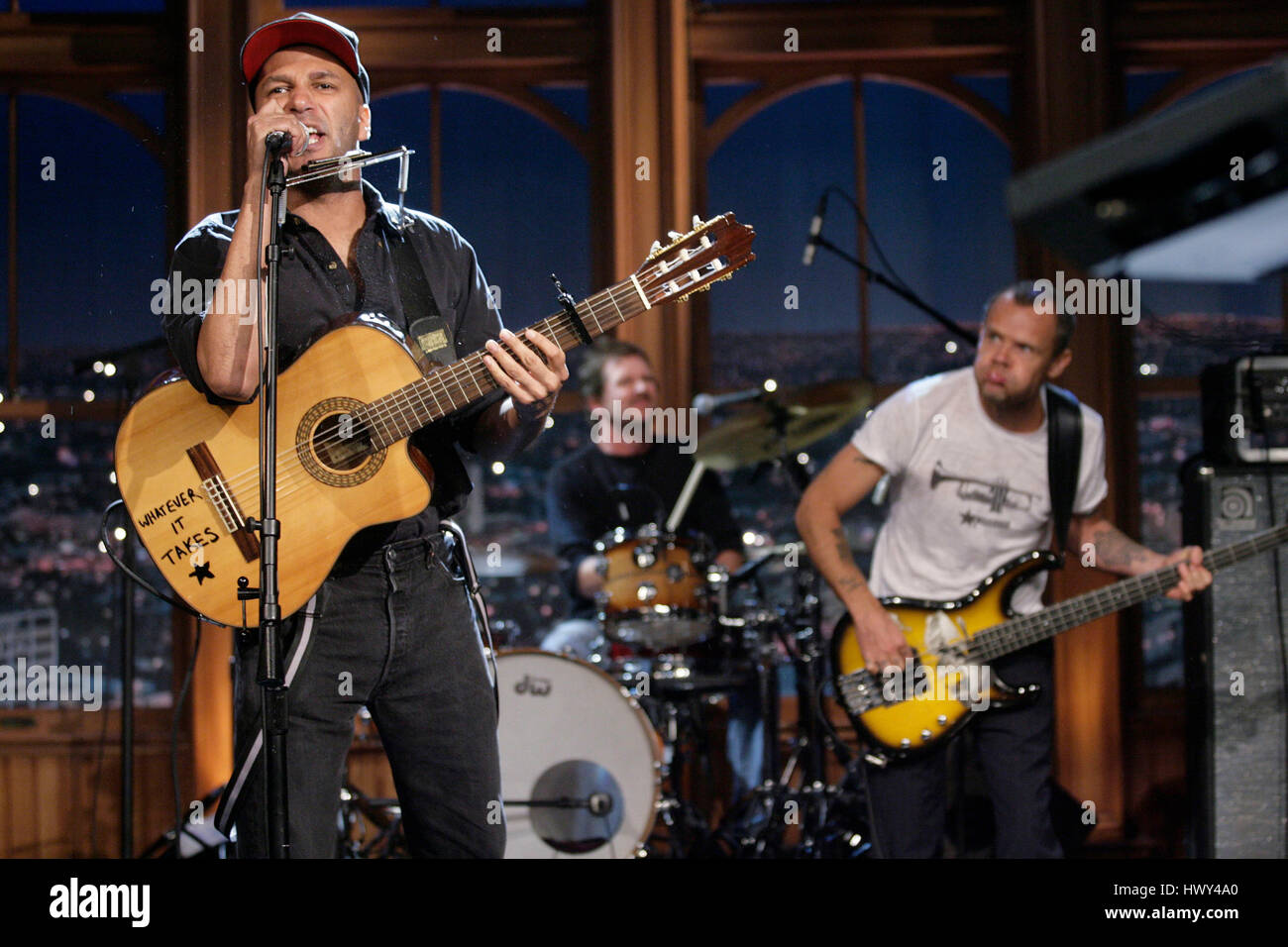 Guitarist Tom Morello, left, and Flea on bass, perform during a segment