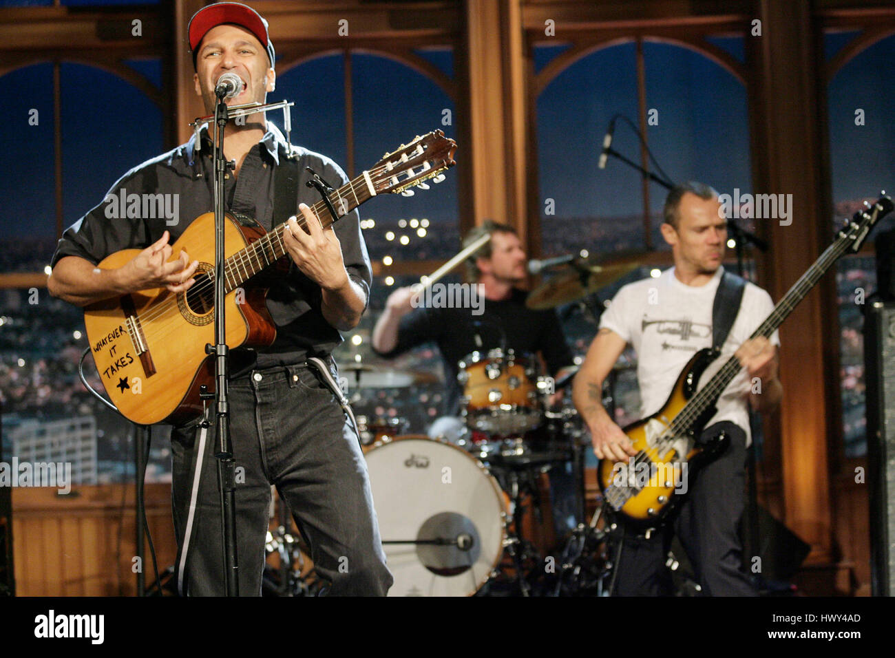 Guitarist Tom Morello, left, and Flea on bass, perform during a segment