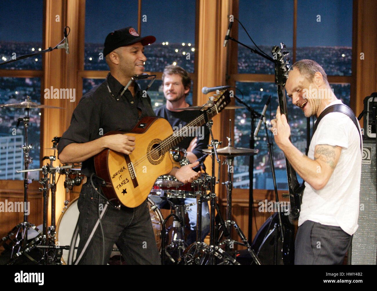 Guitarist Tom Morello, left, and Flea on bass, perform during a segment