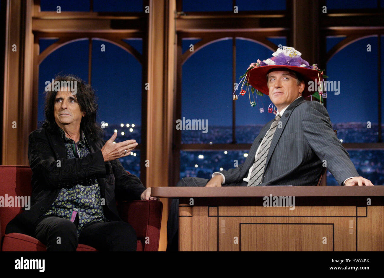 Musician Alice Copper, left, give host Craig Fergsuon a hat during a segment of 'The Late Late Show with Craig Ferguson' at CBS Television City on Sept.10, 2008 in Los Angeles, California. Photo by Francis Specker Stock Photo