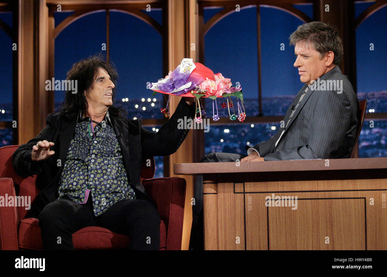 Musician Alice Copper, left, give host Craig Fergsuon a hat during a segment of 'The Late Late Show with Craig Ferguson' at CBS Television City on Sept.10, 2008 in Los Angeles, California. Photo by Francis Specker Stock Photo