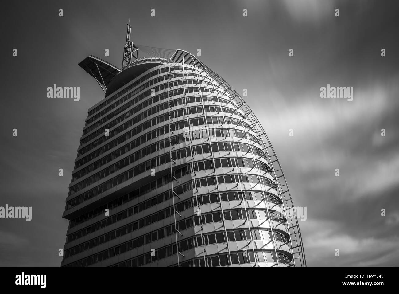 Bremerhaven, Germany - March 11, 2017: Long exposure shot of Atlantic Hotel Sail City building shaped in form of a sail resembling an iconic building  Stock Photo