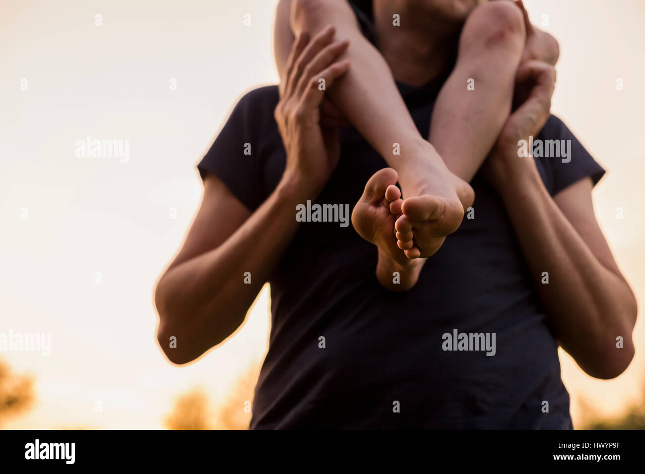 Close-up of father carrying his son on shoulders Stock Photo