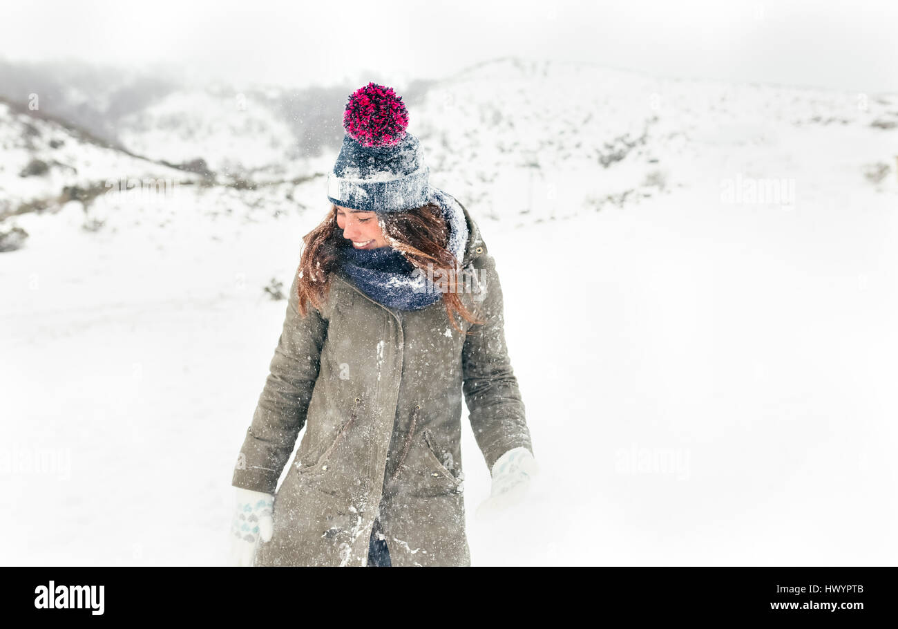 Portrait of a beautiful woman in the snow Stock Photo - Alamy