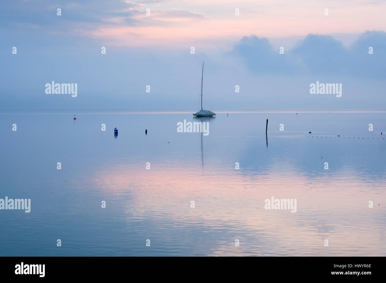 Germany, Bavaria, sailing boat on Lake Starnberg at dawn Stock Photo