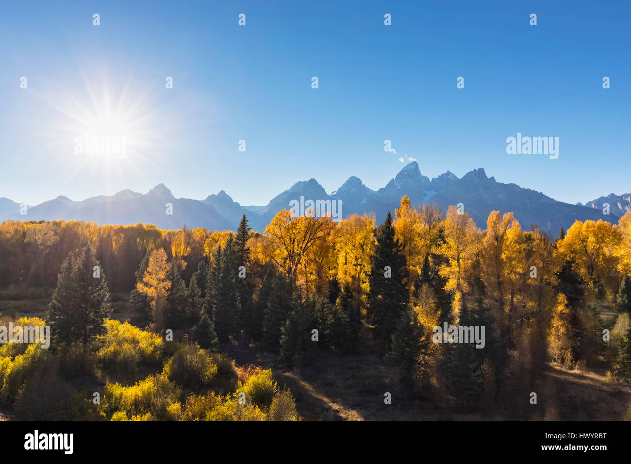 USA, Wyoming, Rocky Mountains, Grand Teton National Park,  Cathedral Group and aspens in autumn Stock Photo
